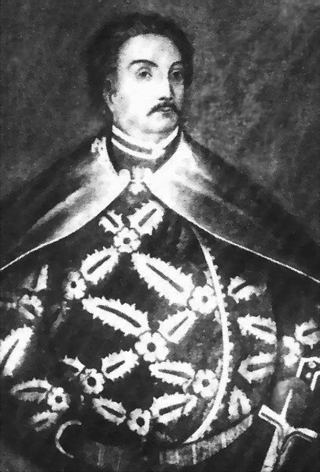 Schwarzes und weißes Foto von Papst Johannes Paul II. in Priesterrobe, der eine schwarze Robe mit weißem Kragen und Manschetten trägt und die Hände verschränkt hält.